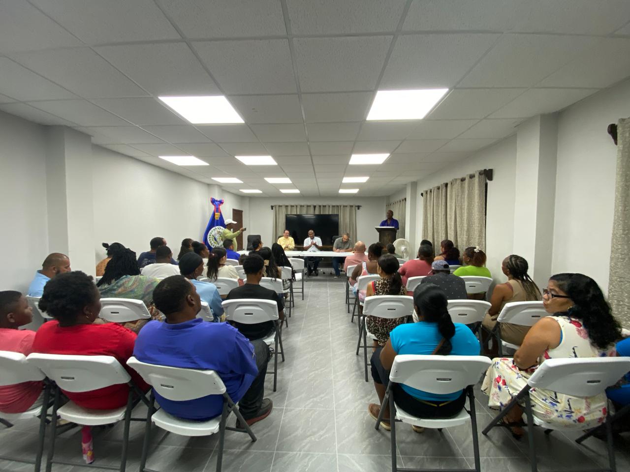 A public session with a head table and a speaker at the podium