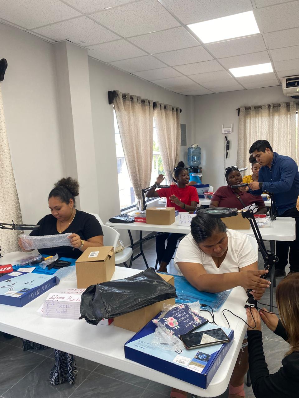 Hands-on repair practice at the magnifier stations